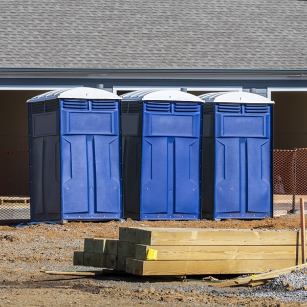 what is the cost difference between standard and deluxe porta potty rentals in Caspian MI